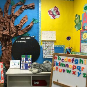 Classroom with magnetic alphabet tiles on a board.